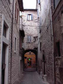An ancient doorway gives way to a brightly lit store window