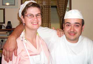 Umberto Simoncelli and his wife Manuela Rocchetti working in their pizza parlor