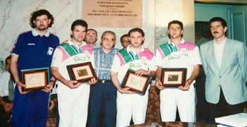 The team poses with the mayor at the banquet held in their honor at the Cagli town hall.