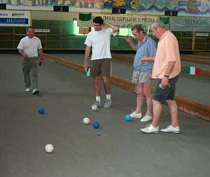 The teams ponder which ball is the closest to the pallino.