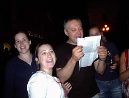 Danielle, Anna, and Ellen help Bicio sing the 'Star Spangled Banner'