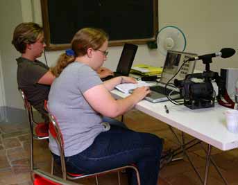 Ann Marie works on layout while Deirdre edits video