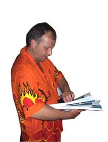 Richard flips through his guidebook