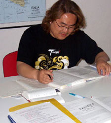 Bok-Young Heo concentrates on Italian verbs during his lesson.