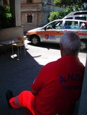 yellow cross volunteers outside headquarters