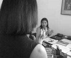 Social worker talking to asstistant