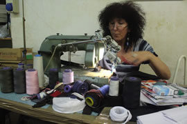 Rosalba Calimeris working a shirt for a friend.