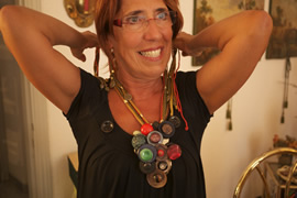 Eriberta displaying her art.