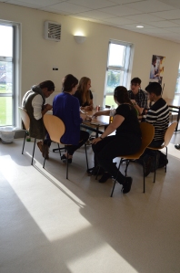 Playing Cards Against Humanity in the hostel dining room.
