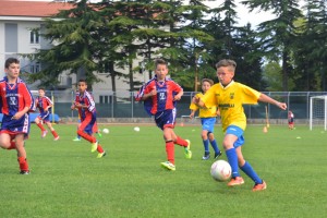 boy kicking ball