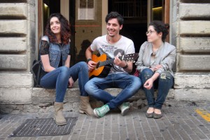Students Giulia Ivanges and Martina Russano enjoy some free time between classes, listening along as a friend strums the guitar. The two will face a high Italian unemployment rate when they graduate.