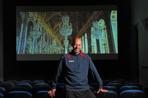 Marco Lazzari stands proudly during a demonstration of the highest quality digital film he owns, a far cry from what once lit up the screen when he was a boy watching his father run the theater.”
