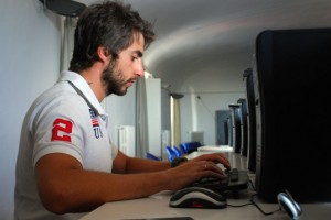 Marco Mignano hard at work in the computer lab at the university. Marco often spends long hours in the lab to perfect his coding skills and to finish his applications.