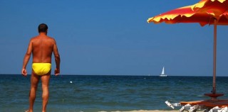 Yellow Speedo on a Blue Flag Beach Getting Flagged for Cleanliness