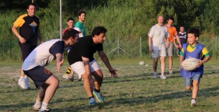 The two Titans, the men’s team and the mini team, get together to play a game of touch rugby.