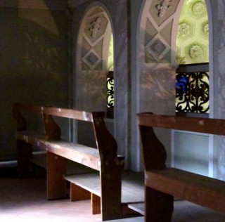 The interior of the empty balconies inside the synagogue where women and children once practiced Judaism. The Empty Synagogue