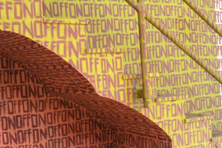 Arches under the stairs provide interesting detail to the art piece.