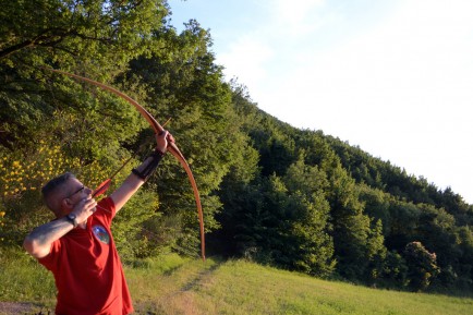 Stefano Barzotti takes aim for the sun in an archers' stance.