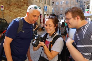 Faculty & students working on photography in the piazza