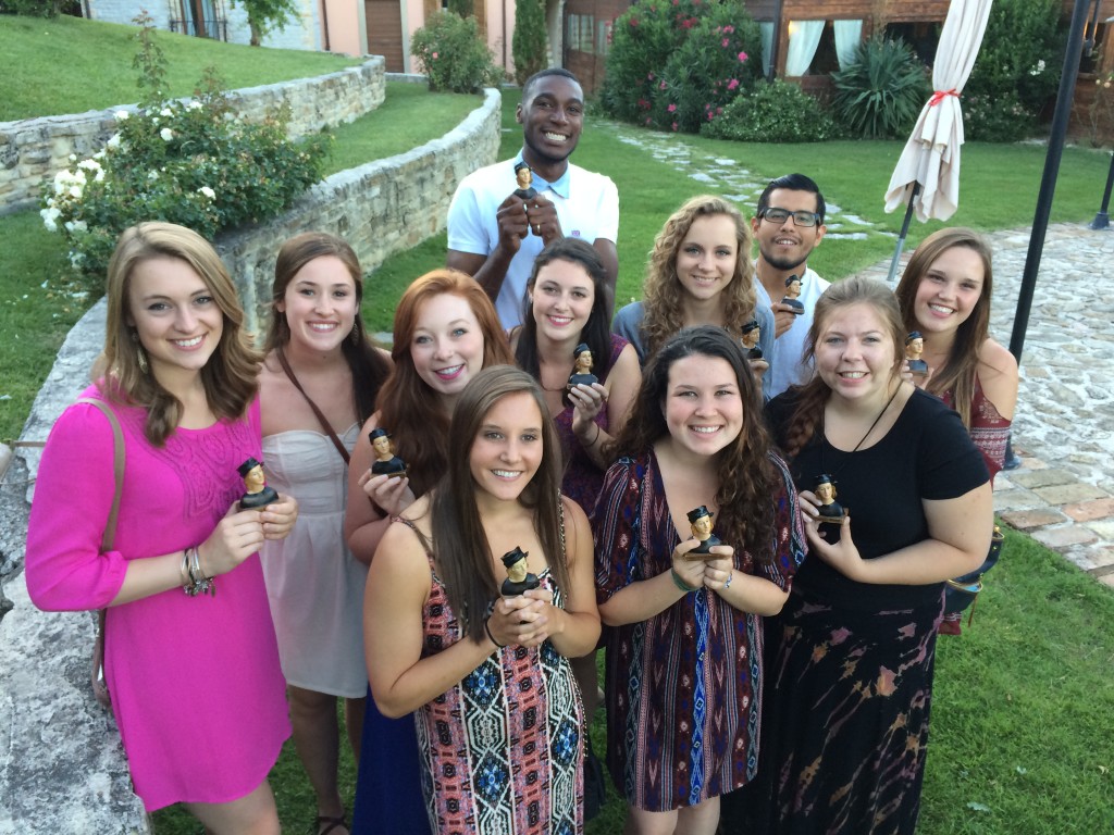 2014 Urbino Project Raffie Winners. Back Row: Devon Jefferson. Middle Row: Caroline Davis, Michele Goad, Abigail Moore, Rebecca Malzahn, Kendall Gilman, Manuel Orbegozo. Front Row: Tessa Yannone, Deanna Brigandi, Sarah Eames, Rachel Mendelson.