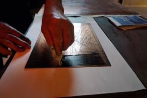 Marcello Tiboni demonstrates his lithography techniques at an exhibit in Urbino, Italy.