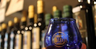 The olive oil tasting glass is blue to hide the color of the oil and prevent biases in a judge. Color is no indication of the quality of oil.