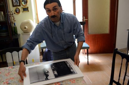 Florindo Rilli showing his previous works.  Photo by Rachelle Favorite / Gonzaga in Cagli